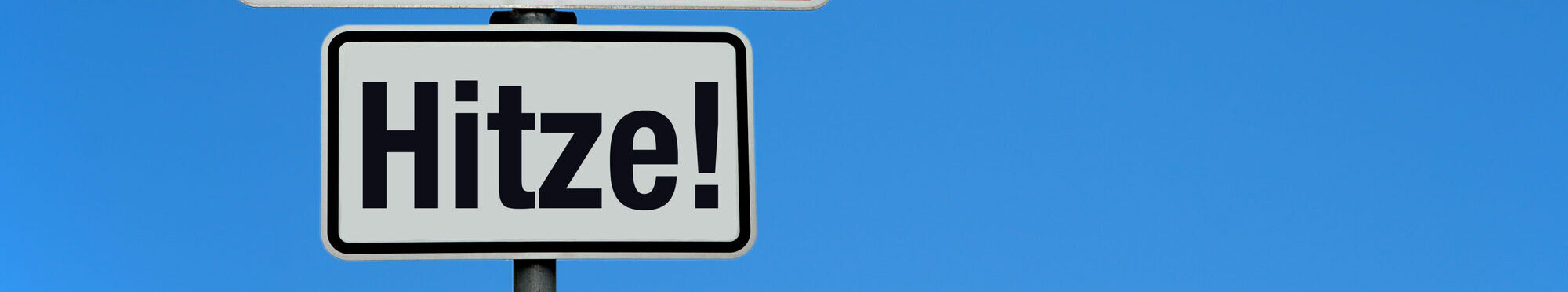 Hitze mit Achtung Schild