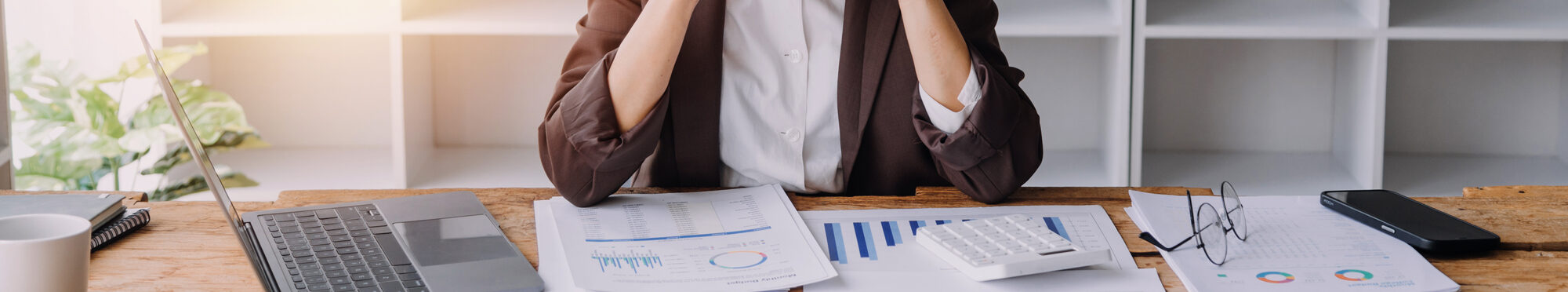 Close up bookkeepers working with balance sheet to analyze problems and find solutions to bringing develop business organization and company's stock market system. Common stock and preferred stock.