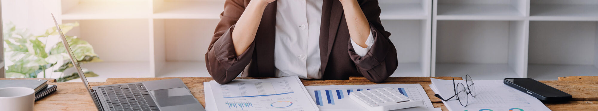 Close up bookkeepers working with balance sheet to analyze problems and find solutions to bringing develop business organization and company's stock market system. Common stock and preferred stock.