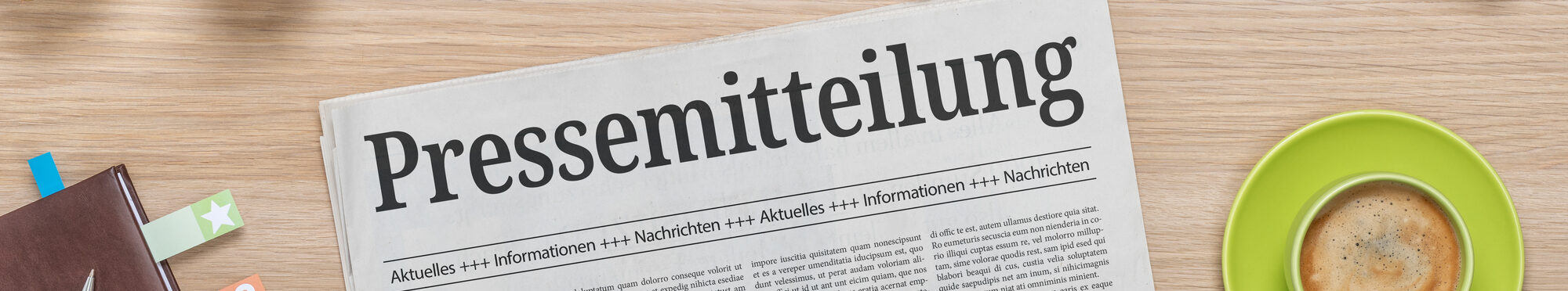 Zeitung mit der Aufschrift "Pressemitteilung"