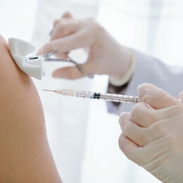 Nurse vaccinating patient