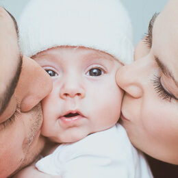 Young mother and father with newborn