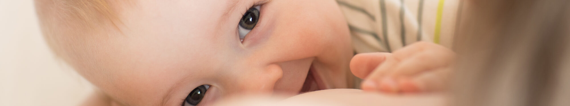 Picture of baby feeds mom's breast