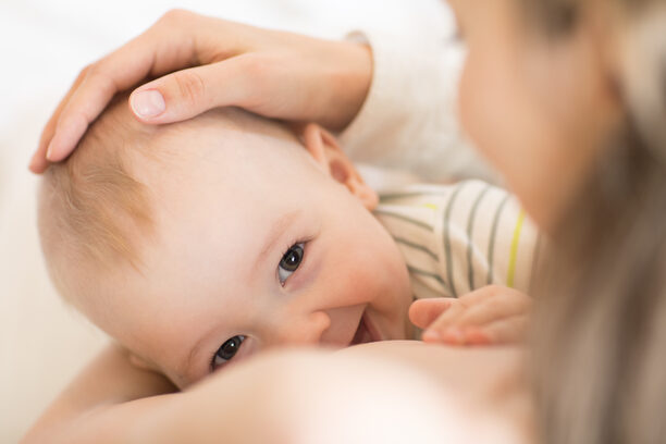 Picture of baby feeds mom's breast